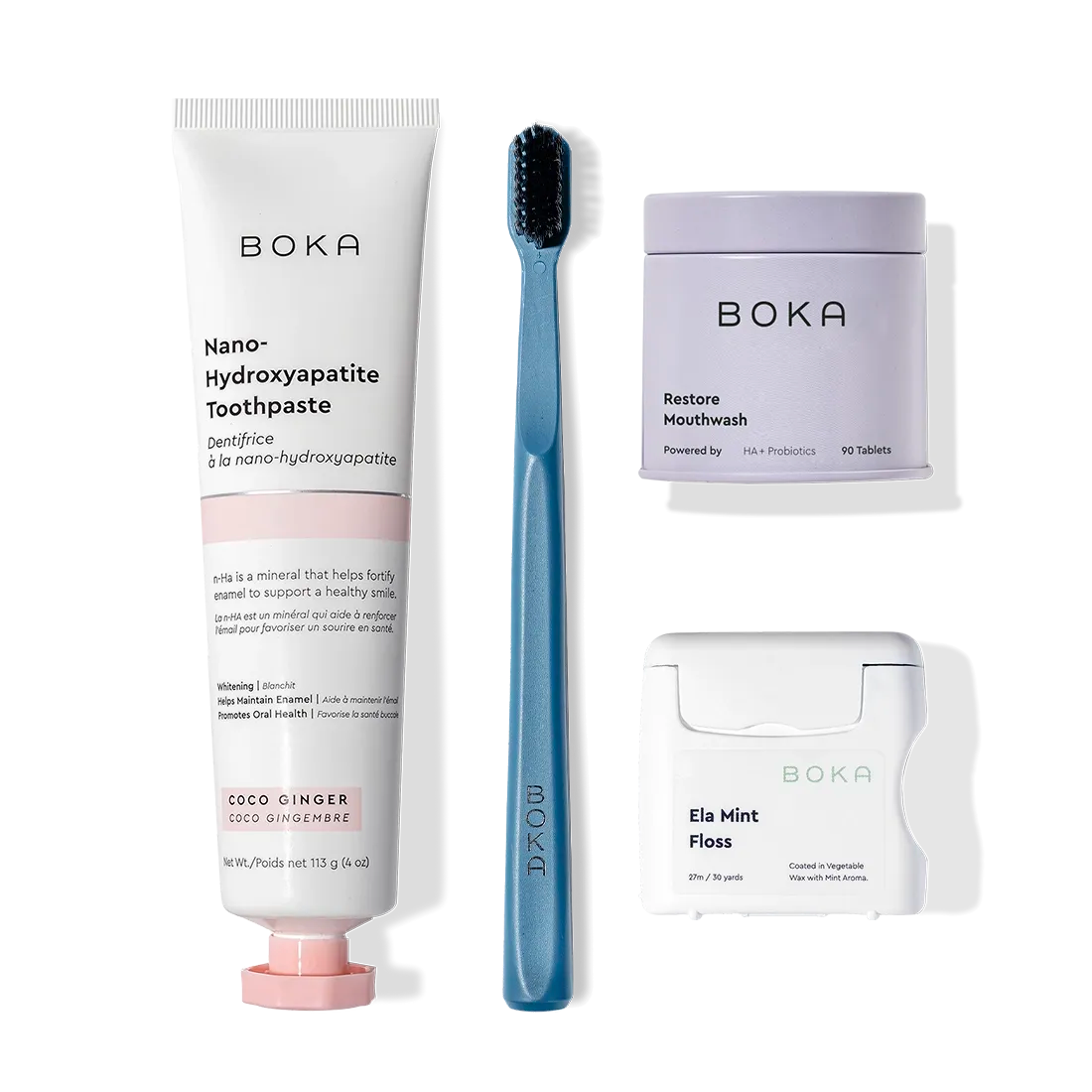 Advanced Kit, featuring kid toothpaste, black toothbrush, mouthwash tablets & floss on white background.