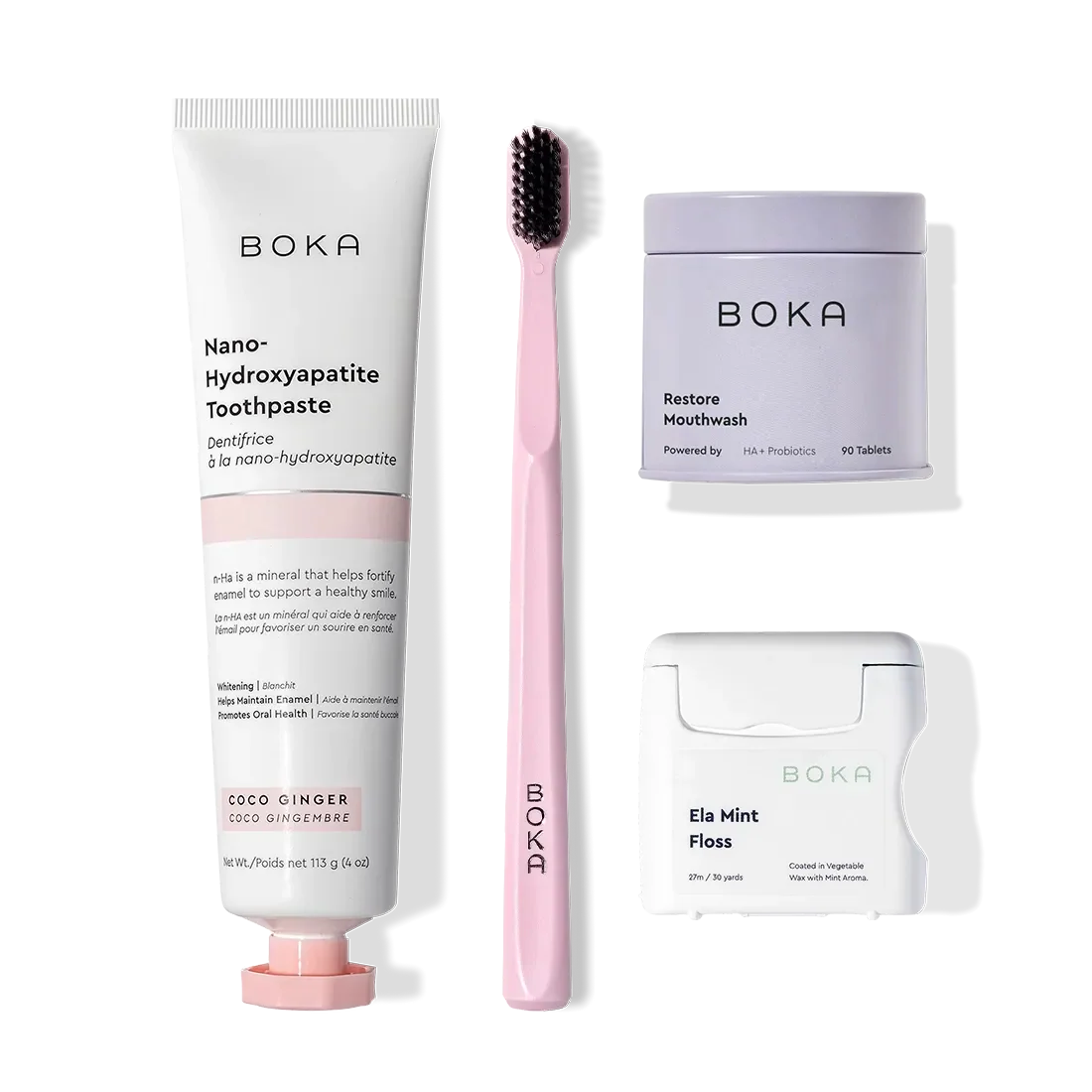 Boka Advanced Kit with kid-friendly toothpaste, pink toothbrush, mouthwash tablets, and floss.