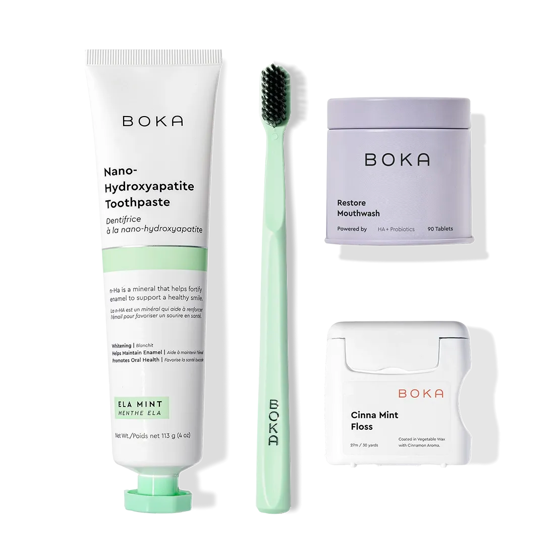 Boka Advanced Kit with kids toothpaste, toothbrush, mouthwash tablets, and floss on white background.
