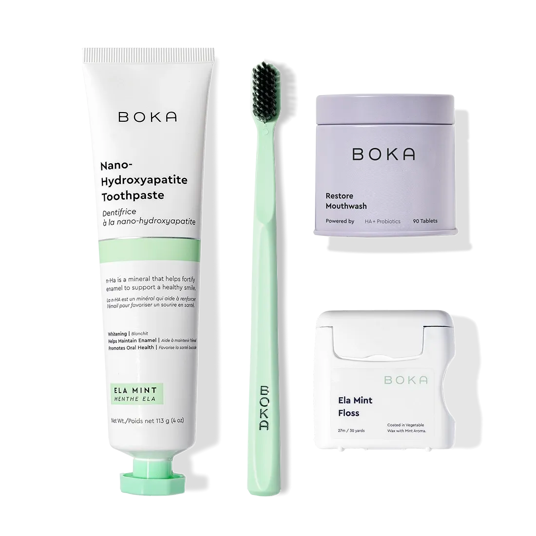Advanced Kit for kids: safe if ingested toothpaste, mint toothbrush, and floss on a white background.