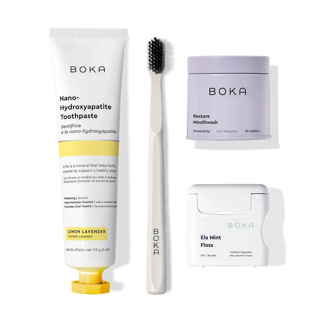 Advanced Kit—safe-for-kids toothpaste, toothbrush & floss arranged on a white background.