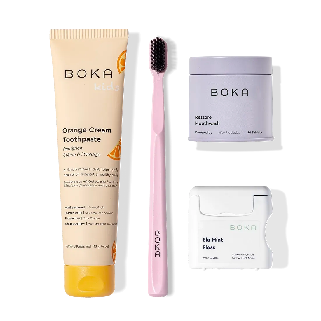 The Advanced Kit includes Boka toothpaste, a pink toothbrush, Restore Mouthwash, and Ela Mint Floss.