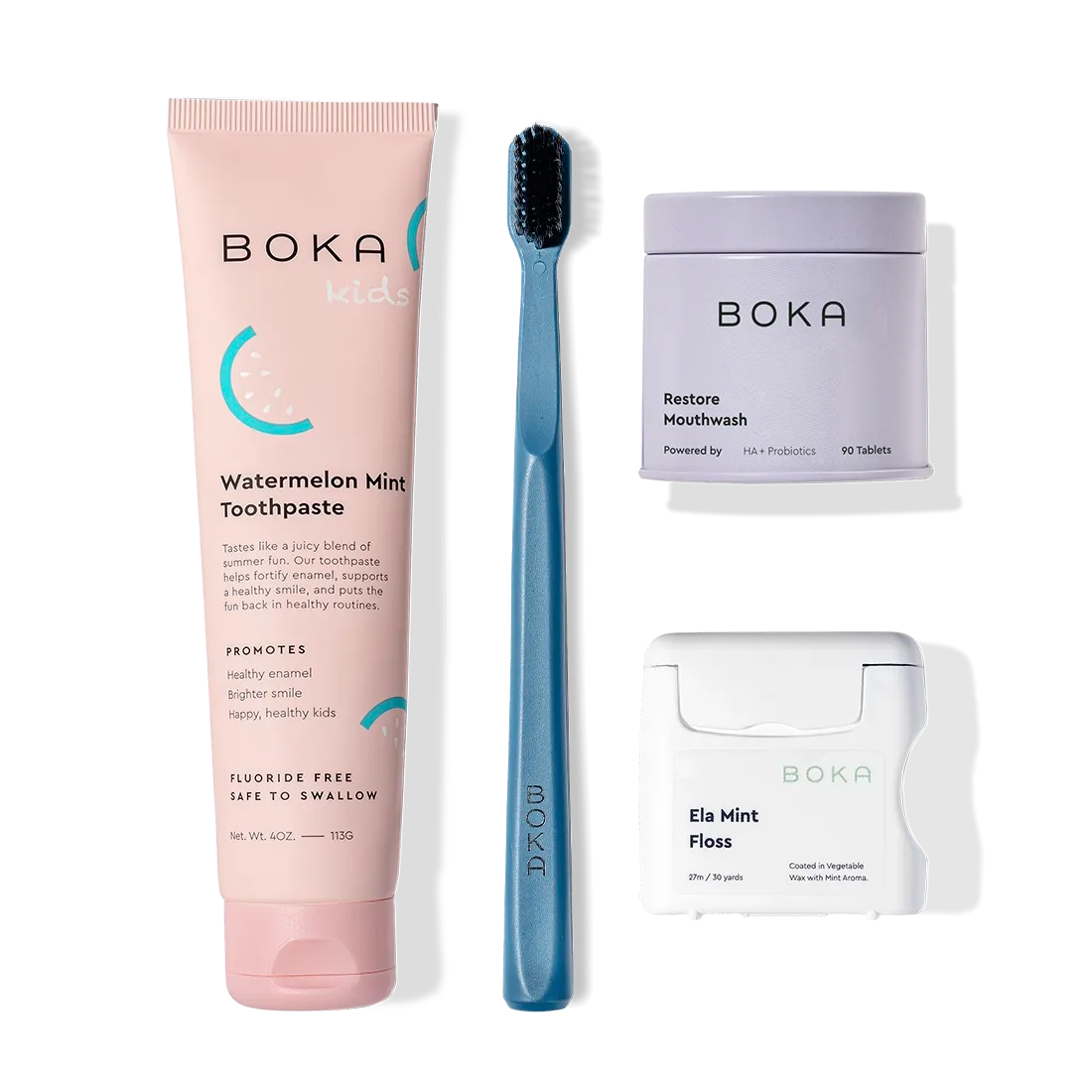 Advanced Kit: toothpaste safe for kids if ingested, toothbrush, floss & mouthwash tablets on white.