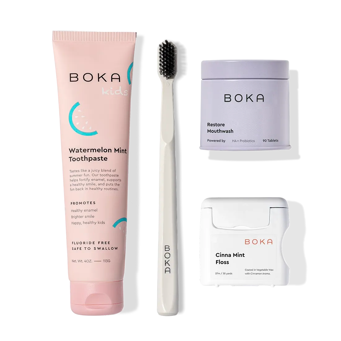 Boka Advanced Kit: kids toothpaste, black toothbrush, mouthwash tablets & Cinna Mint floss on white.