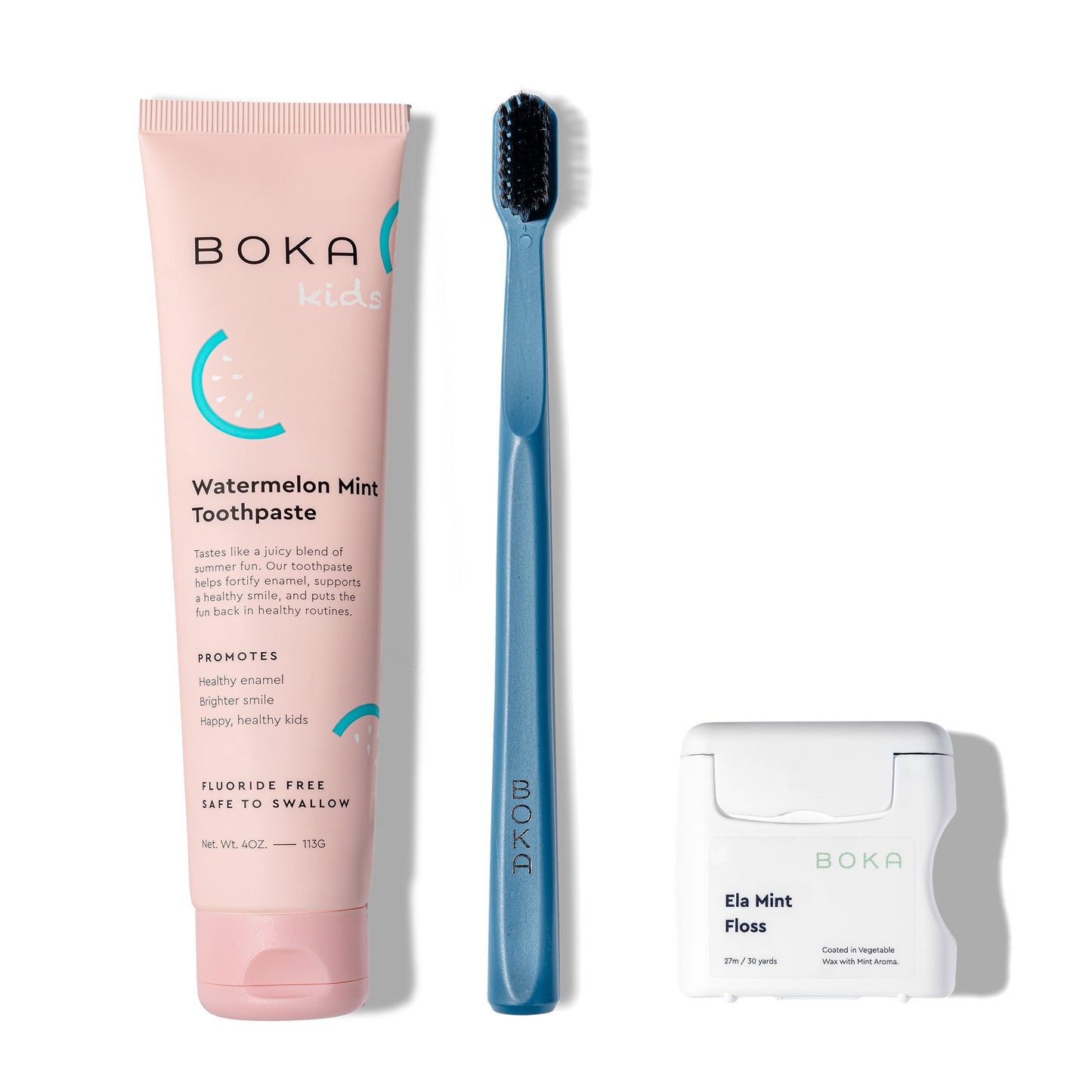 Classic Kit: pink nano-hydroxyapatite toothpaste, blue charcoal toothbrush, teflon-free floss on white.