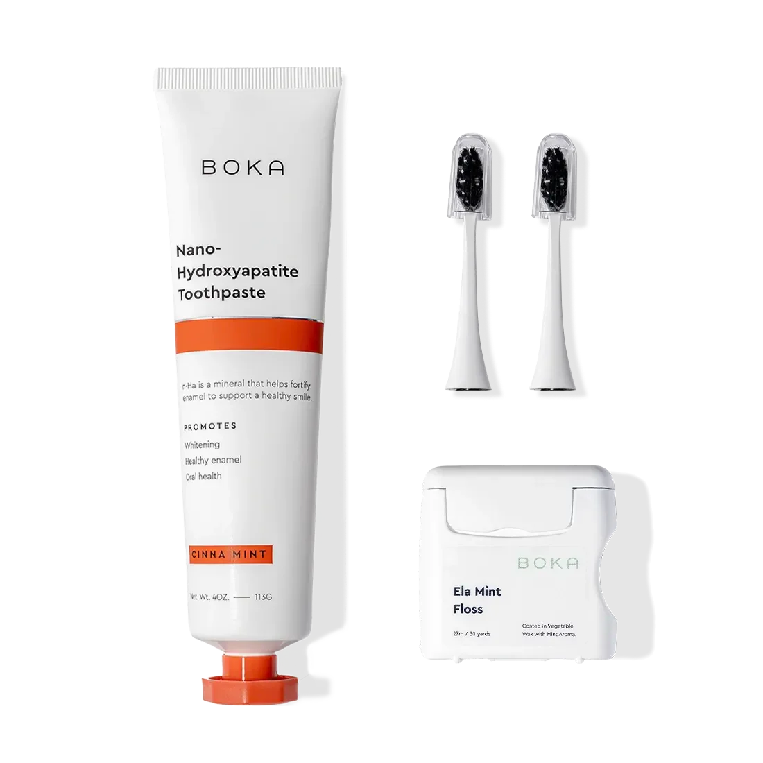 Boka Kit Refill with toothbrush, n-Ha toothpaste, 2 replacement heads, and floss on white background.