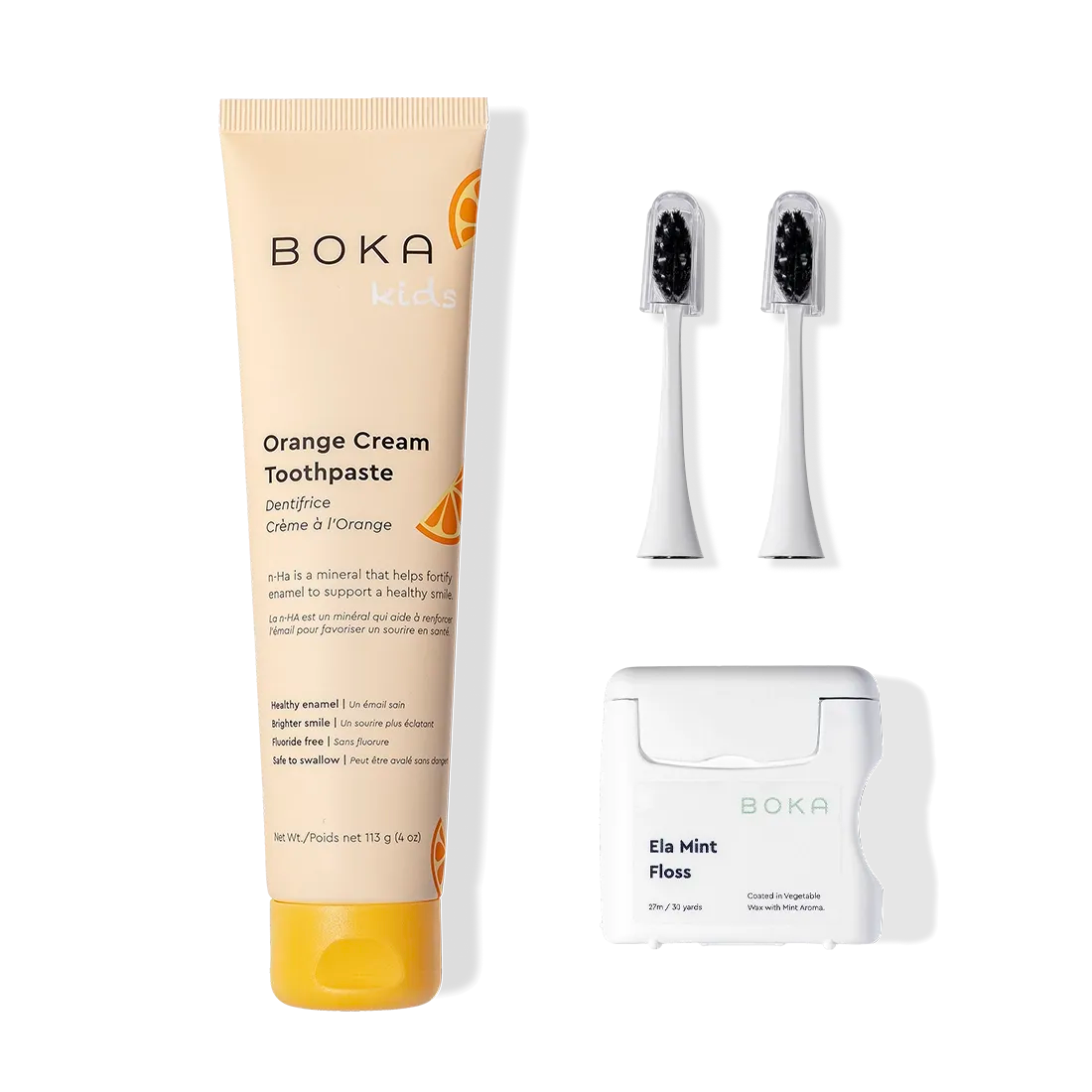 Boka Kit Refill: kids orange cream toothpaste, charcoal brush heads, and Ela Mint floss.