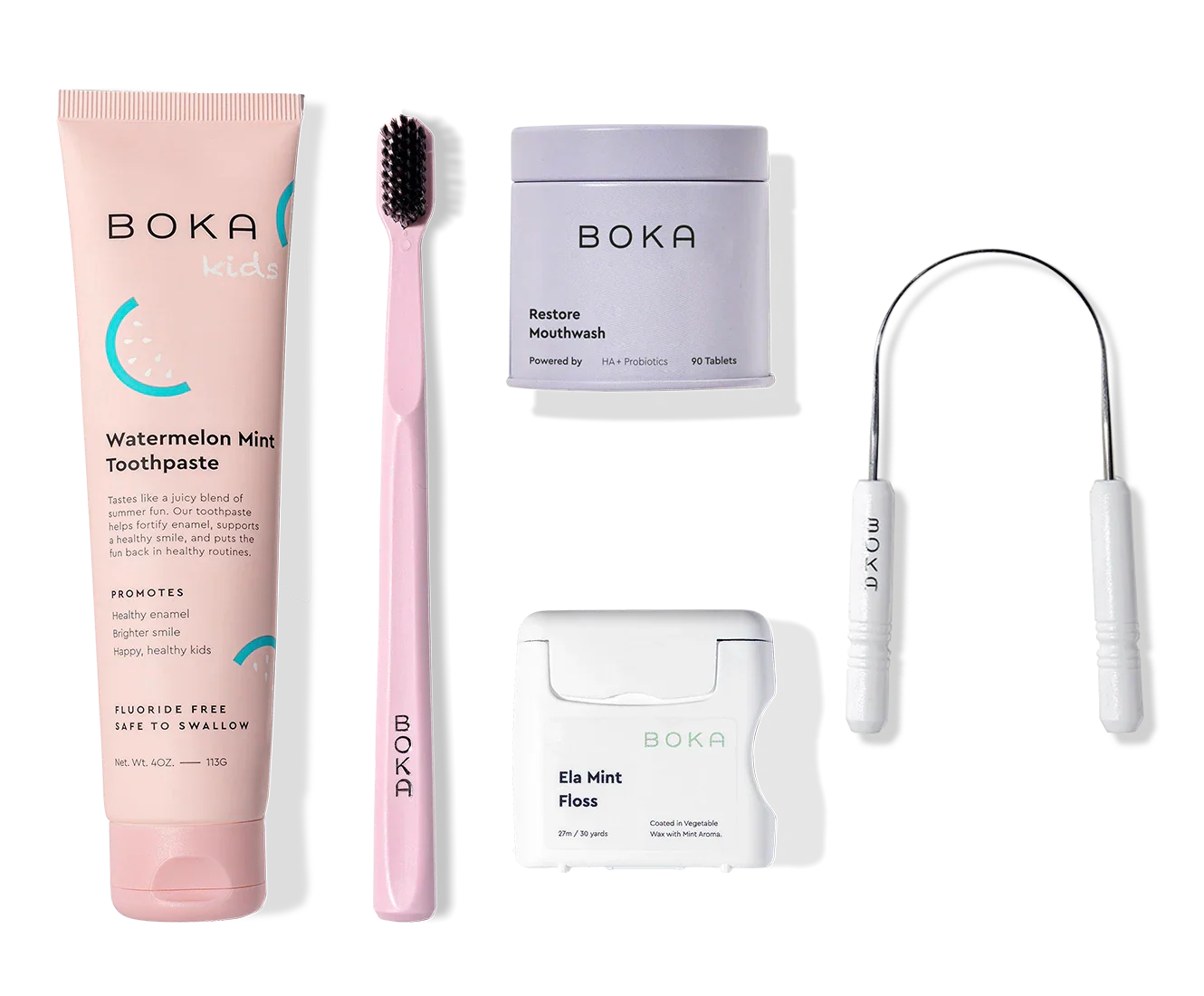 Complete Kit: fluoride-free toothpaste, pink charcoal-bristle toothbrush, and more oral care items.