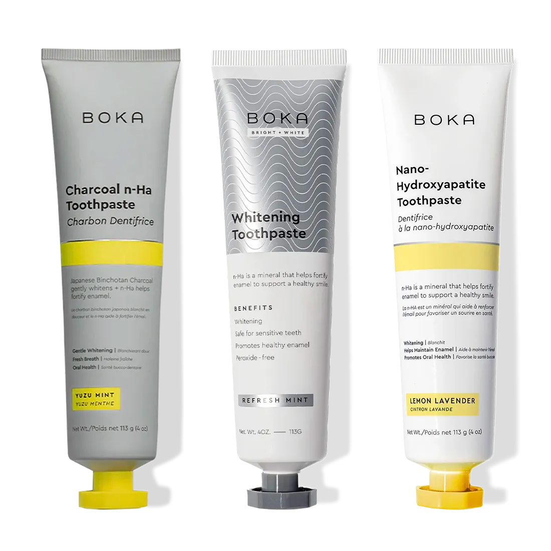 Three upright tubes of Charcoal Yuzu Mint Whitening n-Ha Toothpaste 3-pack in unique formulas.