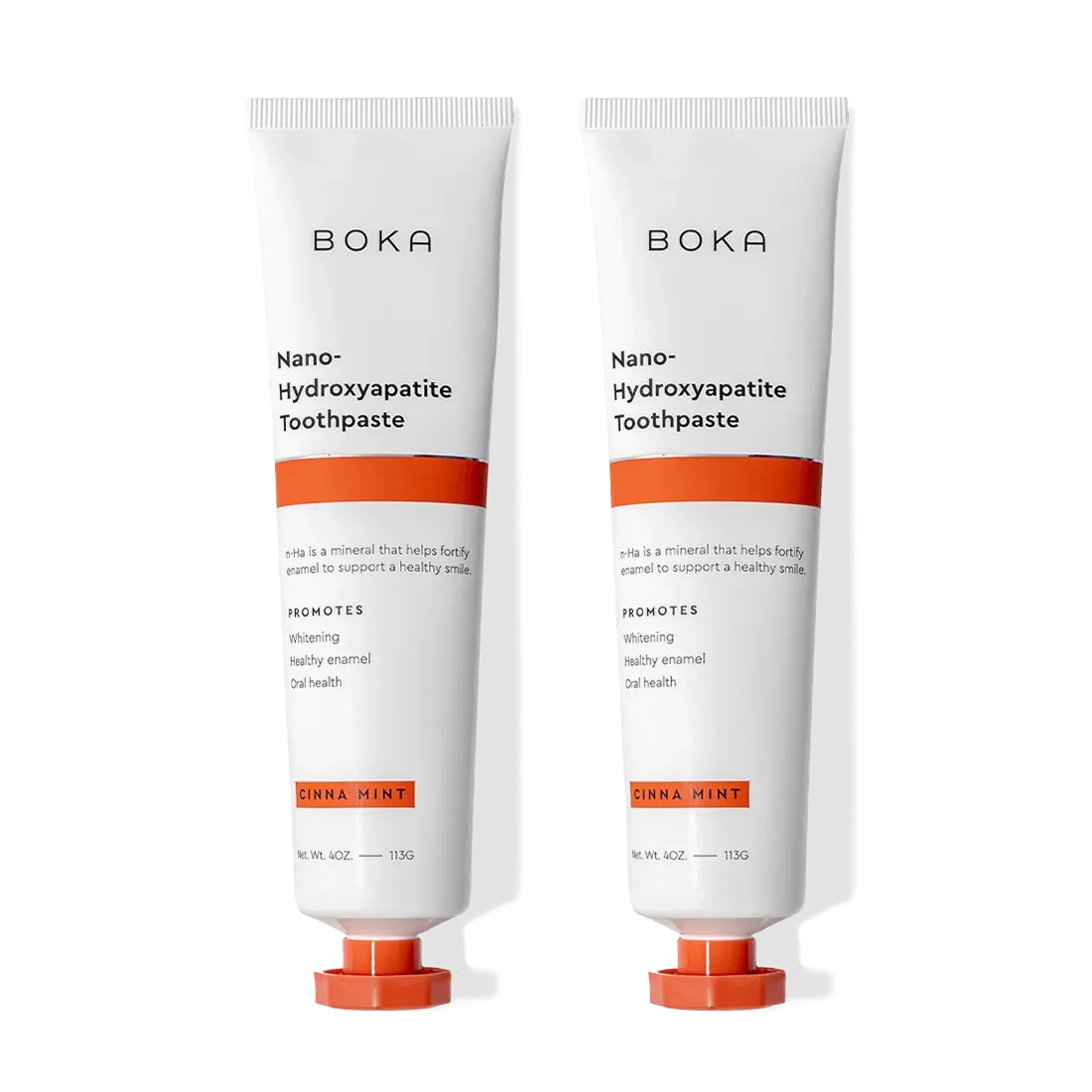 Two tubes of Cinna Mint n-Ha Toothpaste for remineralizing teeth, in orange and white packaging.