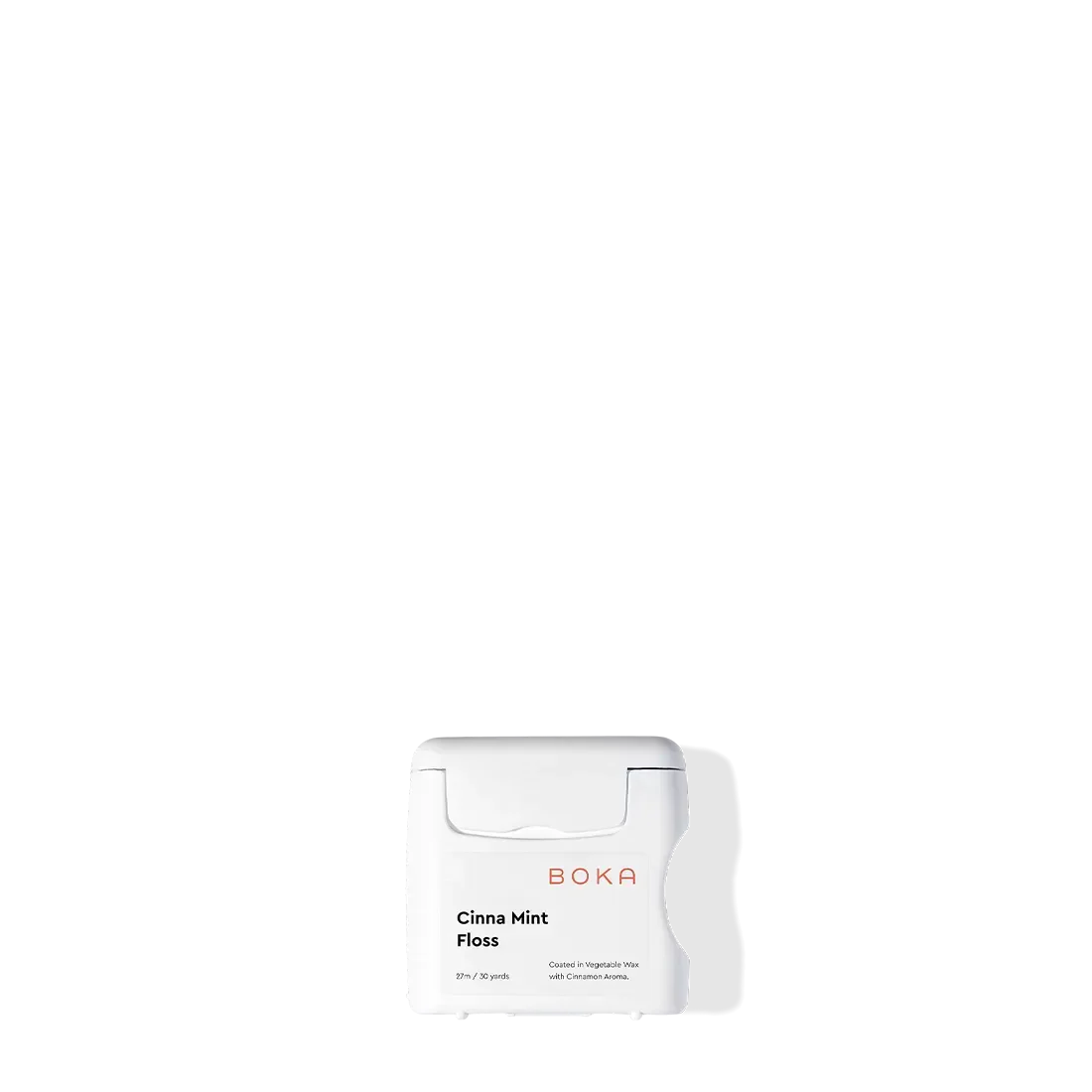 Boka Floss - Cinna Mint with teflon-free natural vegetable wax on a white background and shadow.