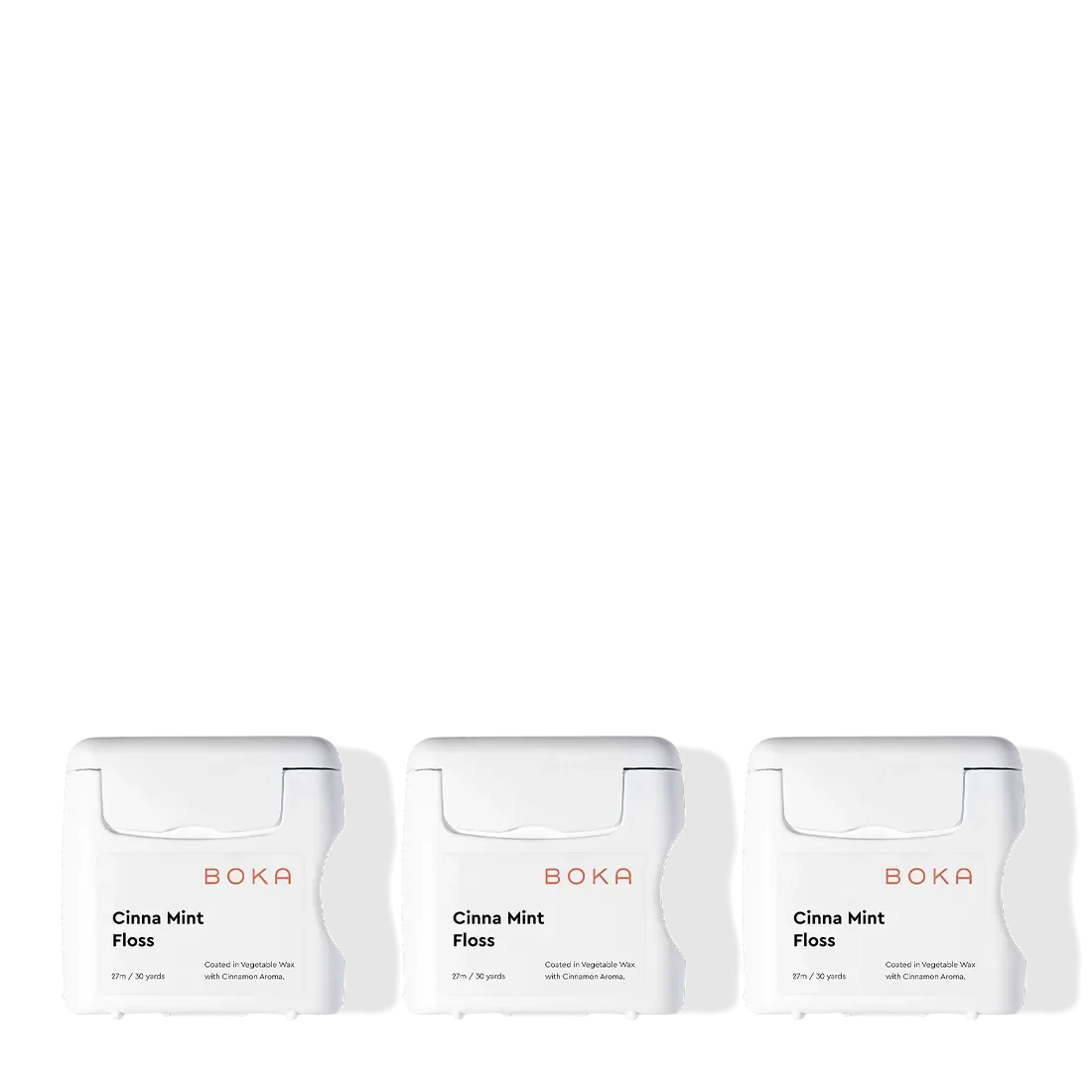 Three Boka Floss - Cinna Mint containers—teflon-free with a spicy cinnamon mint flavor—side by side.