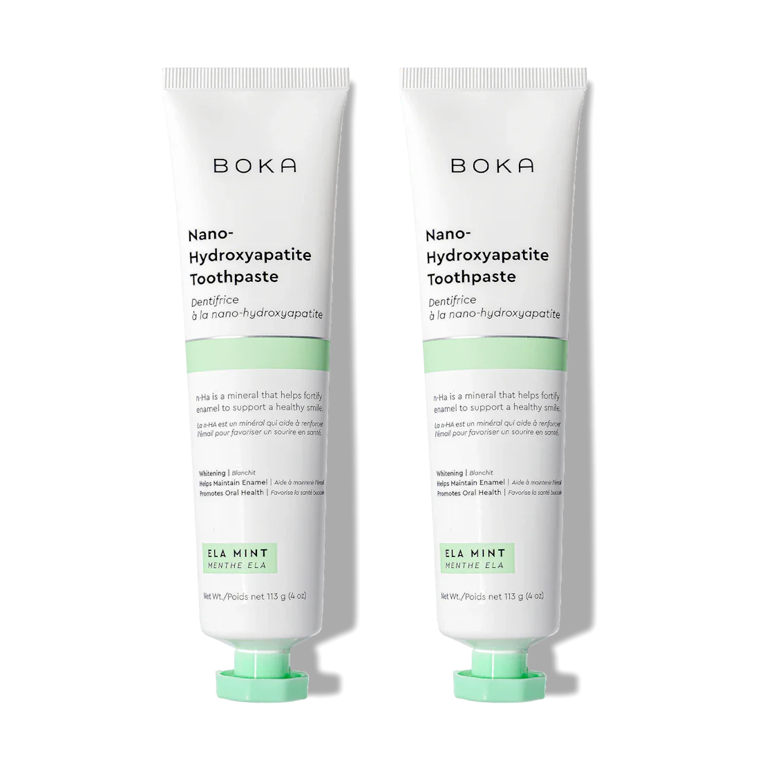 Two upright tubes of Boka Ela Mint n-Ha Toothpaste, fluoride-free with nano-hydroxyapatite.