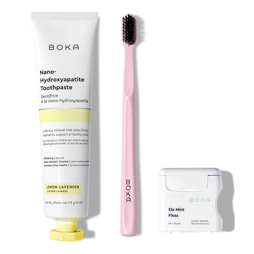 The Classic Kit includes toothpaste, a pink charcoal toothbrush, and teflon-free floss arranged vertically.