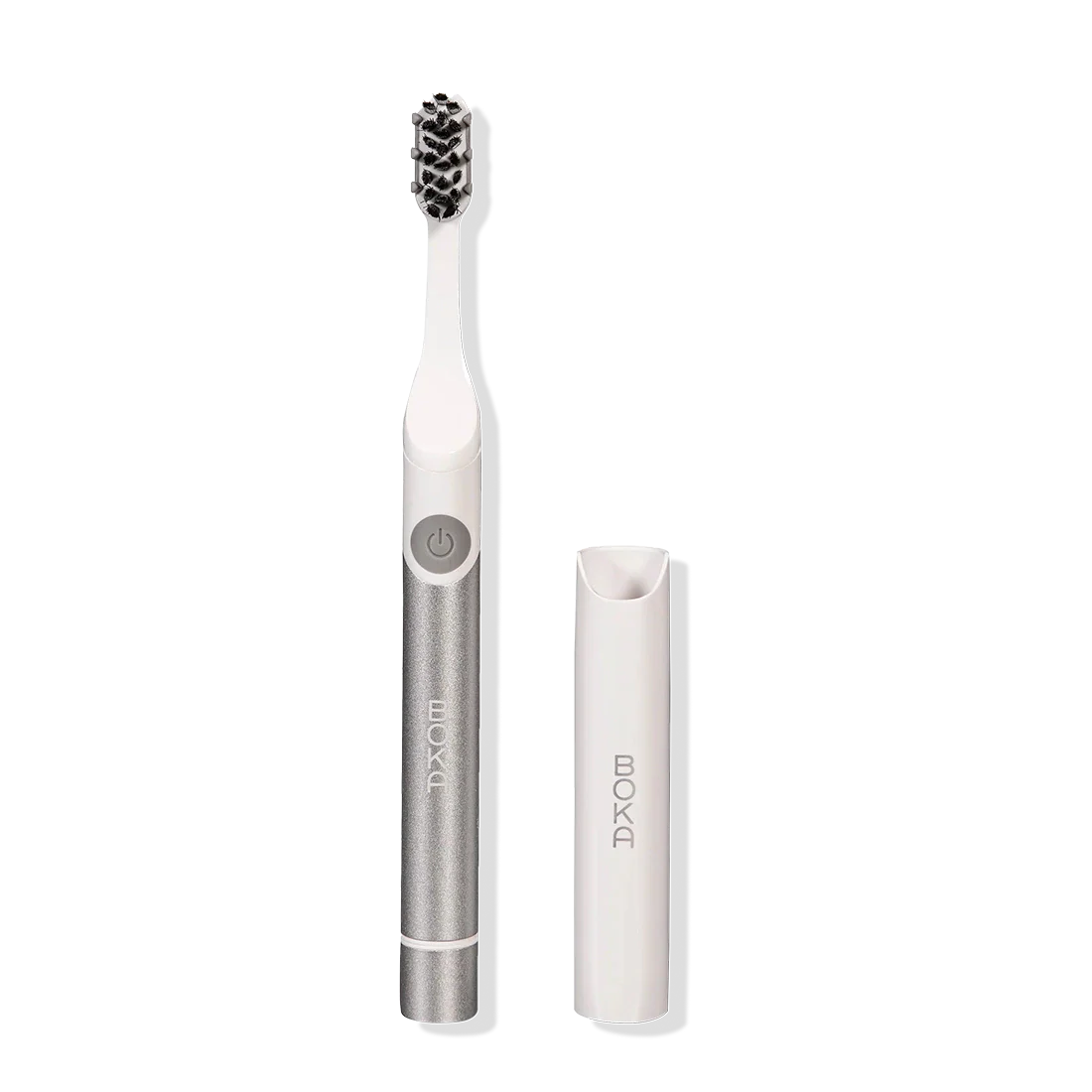Boka Pocket Electric Toothbrush in silver with Sonic Pulse, white brush head, and travel cap.
