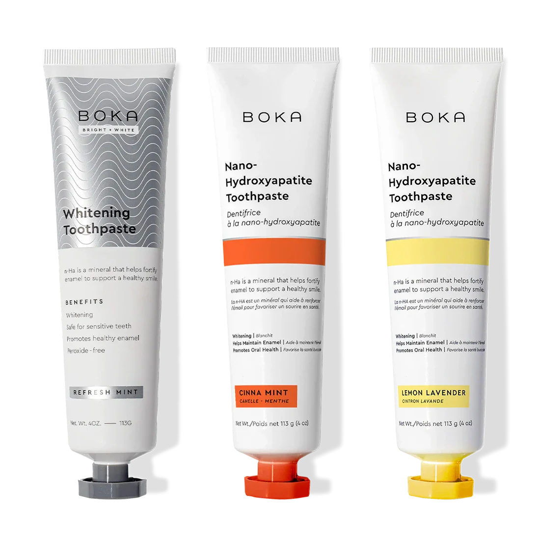 Three Nano n-Ha Toothpaste Whitening 3 Packs—Whitening, Cinna Mint, Lemon Lavender—stand upright.