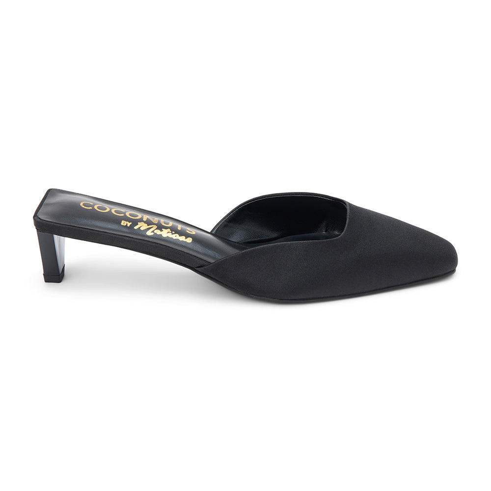 Black satin mule heels with a pointed toe and sleek slip-on design. A sophisticated staple for effortless elegance and modern styling.