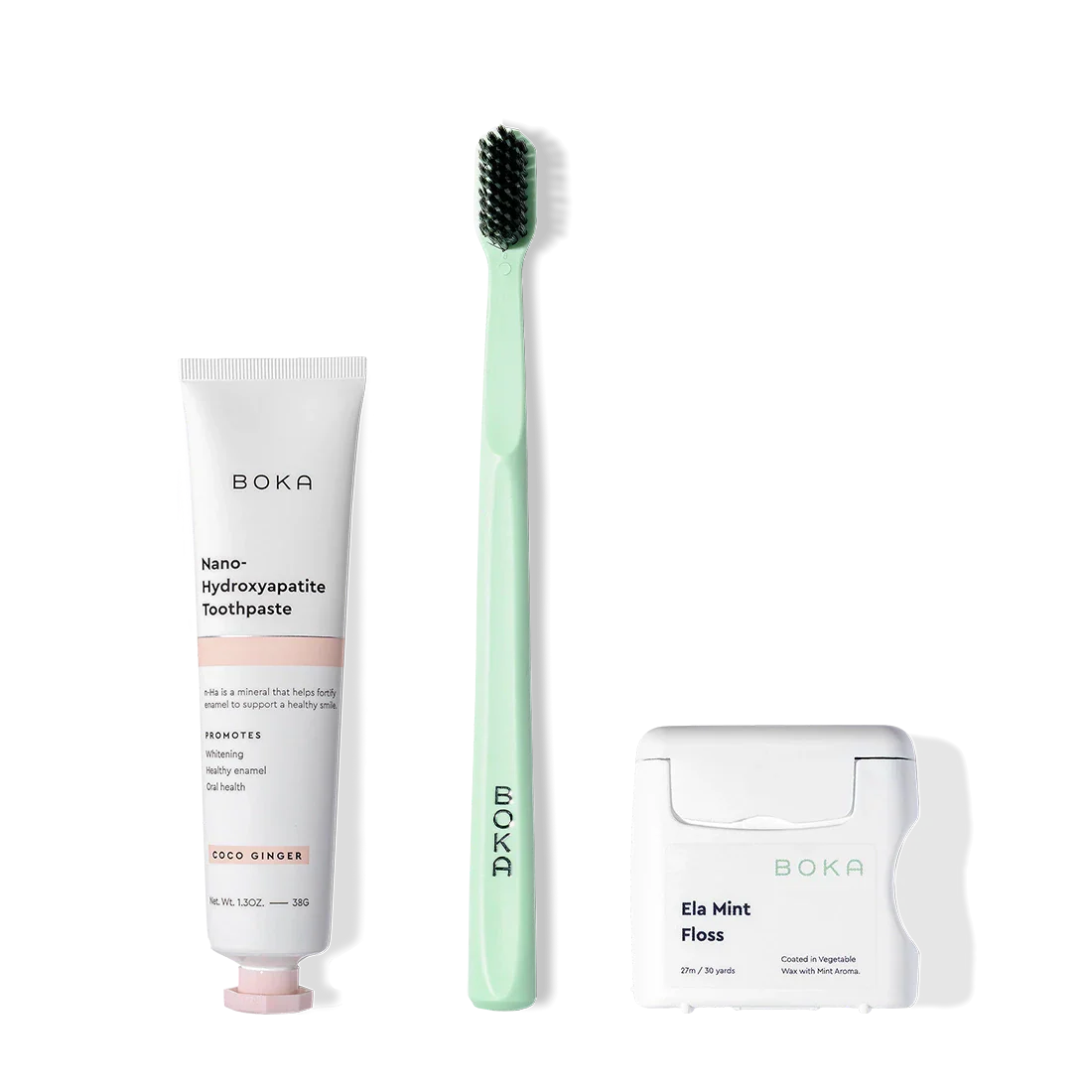 Boka Travel Kit displayed, featuring nano-hydroxyapatite toothpaste, mint toothbrush, and Ela Mint floss.