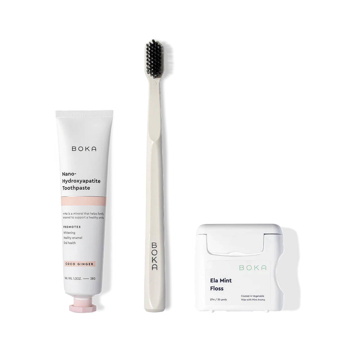 Travel Kit on display, featuring toothpaste, a charcoal toothbrush, and teflon-free floss.