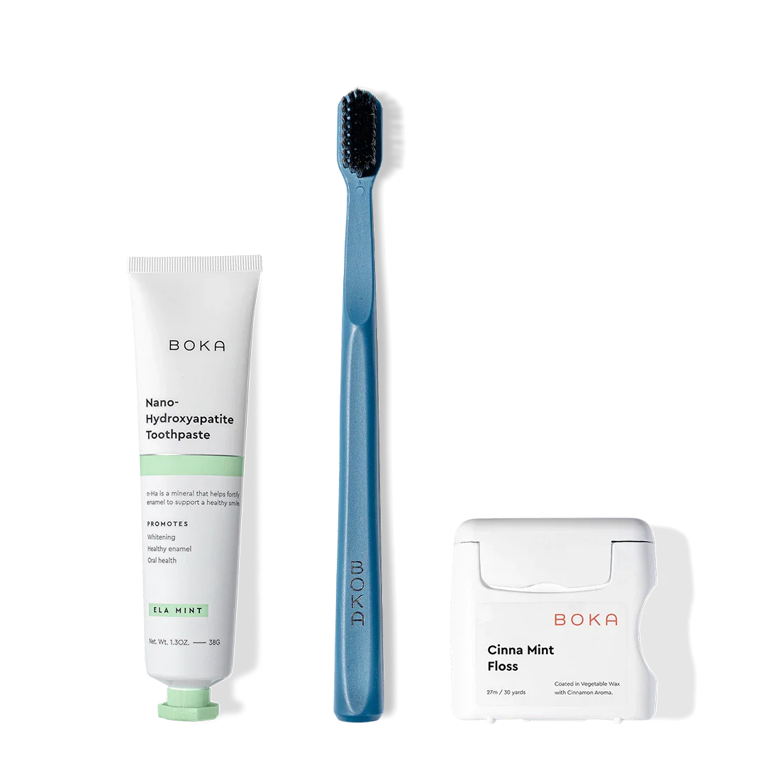 Travel Kit with toothpaste, blue toothbrush (charcoal bristles), and Teflon-free floss on white.
