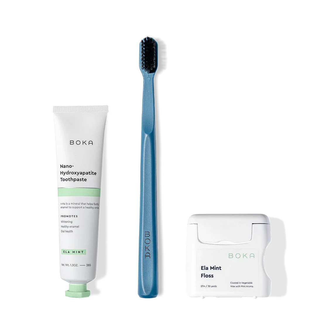 Travel Kit with nano-hydroxyapatite toothpaste, charcoal toothbrush, and teflon-free floss on white.