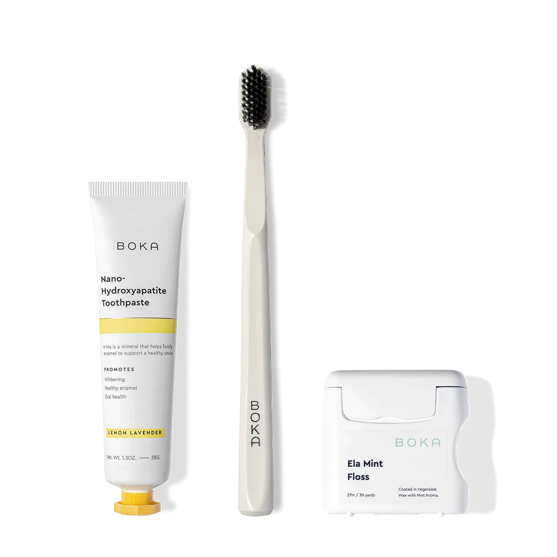 The Travel Kit, featuring Boka toothpaste, charcoal bristle brush, and teflon-free floss on display.