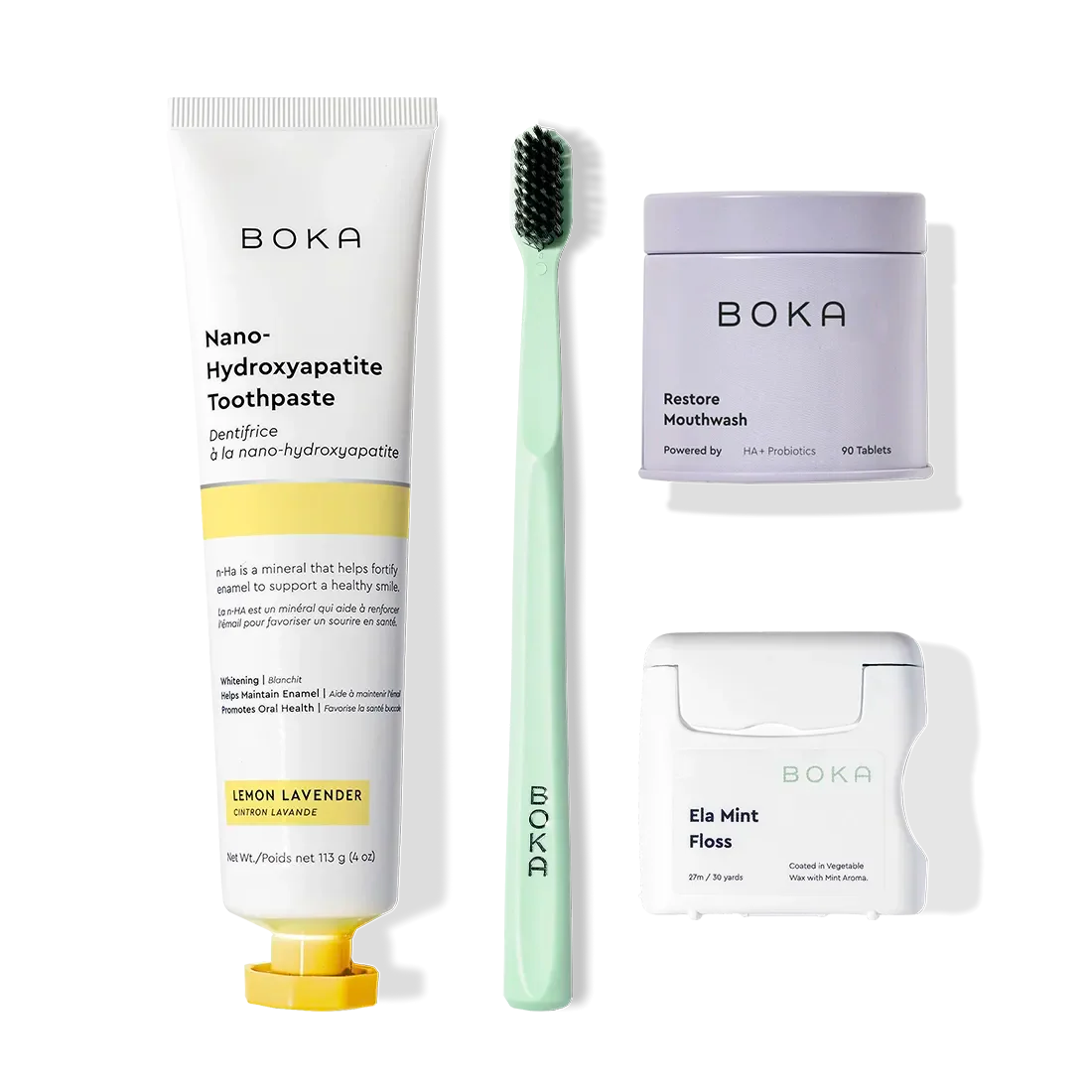 Advanced Kit: toothpaste (kid-safe), green brush, mouthwash tablets, mint floss on white.