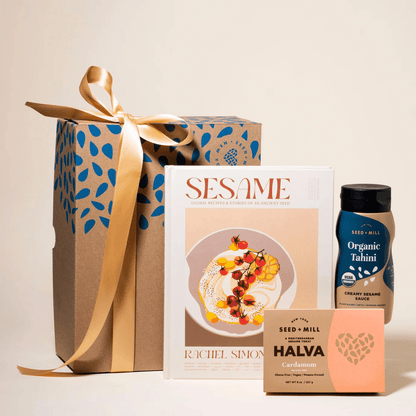 Box with cookbook, tahini, and box of cardamom halva