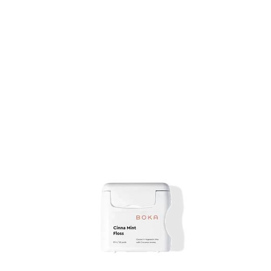Boka Floss - Cinna Mint with teflon-free natural vegetable wax on a white background and shadow.