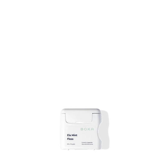 A Boka Floss - Ela Mint BPA-free white container sits against a plain black background.