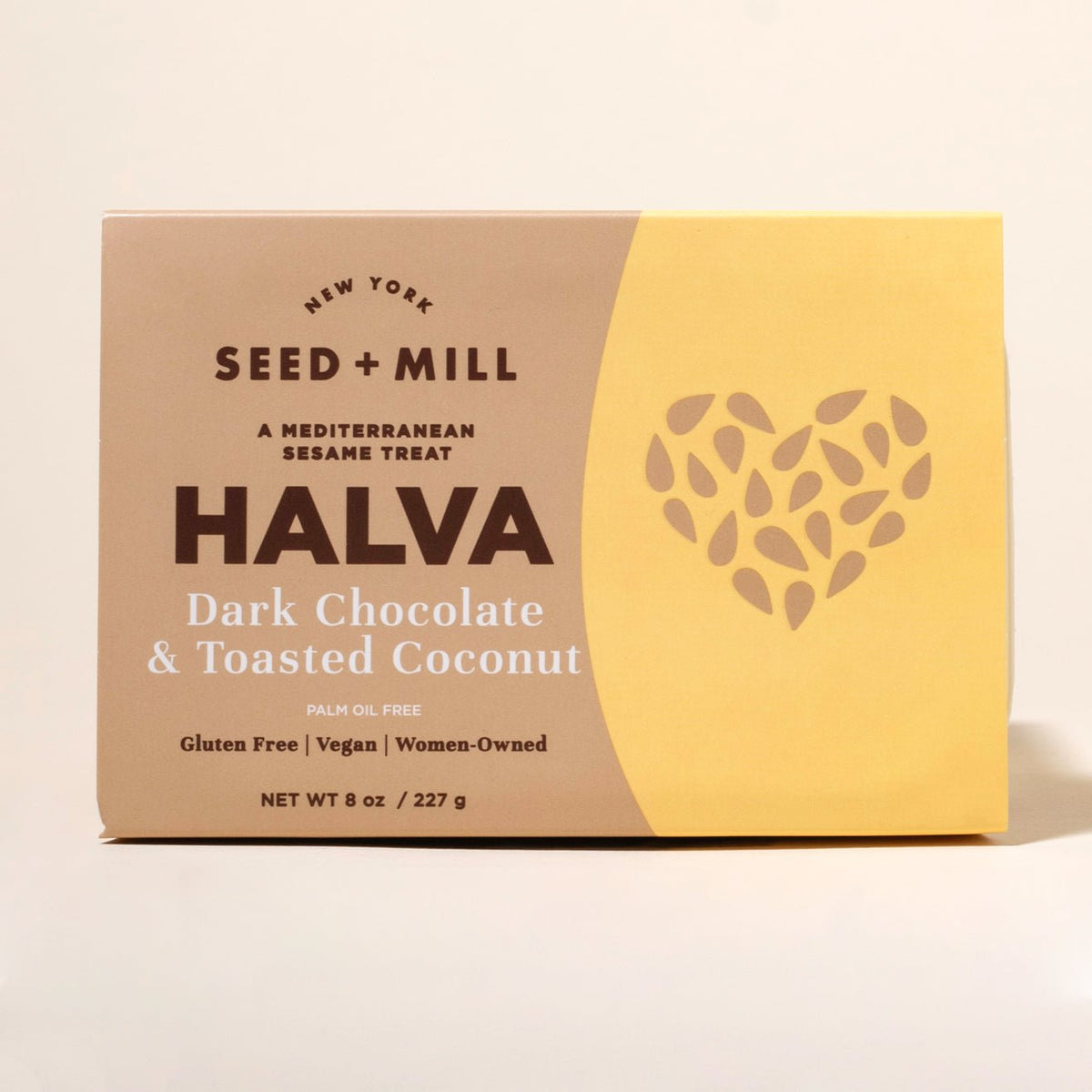 Box of Seed + Mill  dark chocolate and toasted coconut on a beige background