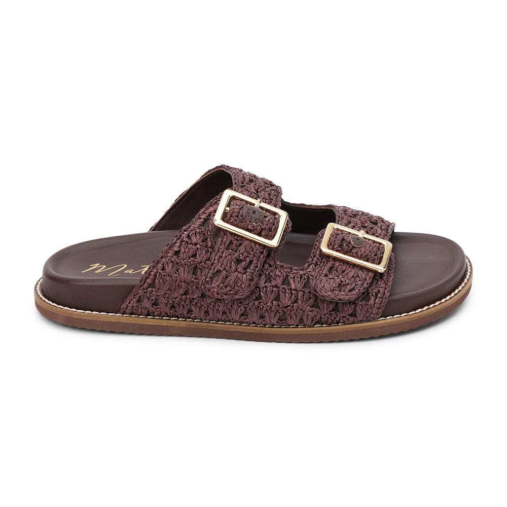 Posey Slide Sandal - Matisse Footwear - Brown woven raffia slide sandals with adjustable gold-tone buckles, a cushioned footbed, and a sturdy sole. A breezy, laid-back style perfect for warm-weather outings.