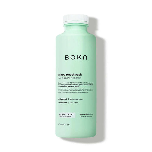 A mint-green bottle of Renew Liquid Mouthwash with black text on a white background.