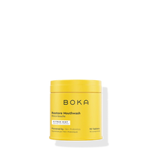 A yellow container of Restore Mouthwash Tablets - Citrus Mint is shown on a white background.