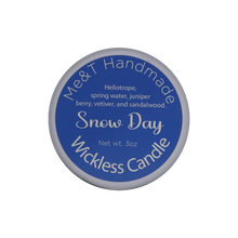 Snow Day Wickless candle shown from the top in a white tin with a blue label