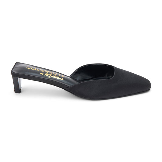 Black satin mule heels with a pointed toe and sleek slip-on design. A sophisticated staple for effortless elegance and modern styling.