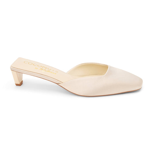 Champagne satin mule heels with a pointed toe and sleek slip-on design. A sophisticated staple for effortless elegance and modern styling.