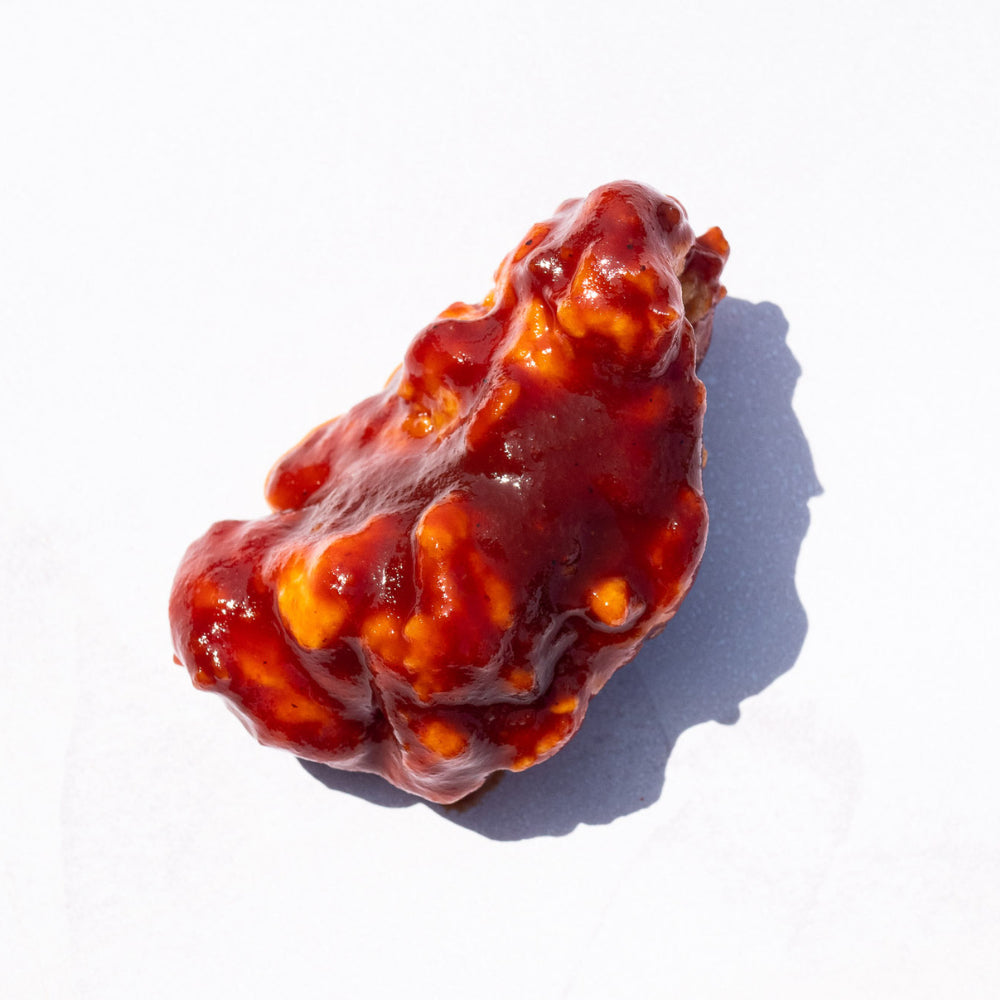Blackbird Plant-Based Texas BBQ Wings covered in sauce