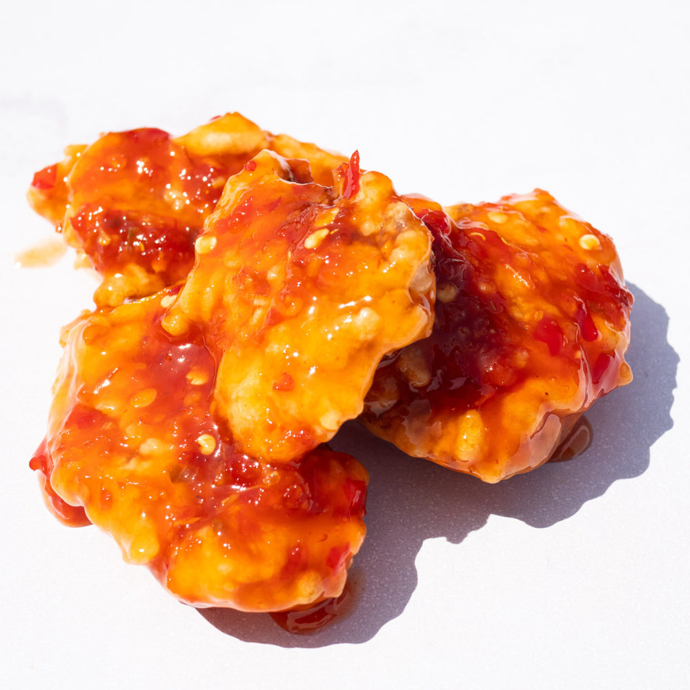 Blackbird Plant-Based Thai Chili Wings coated in sauce