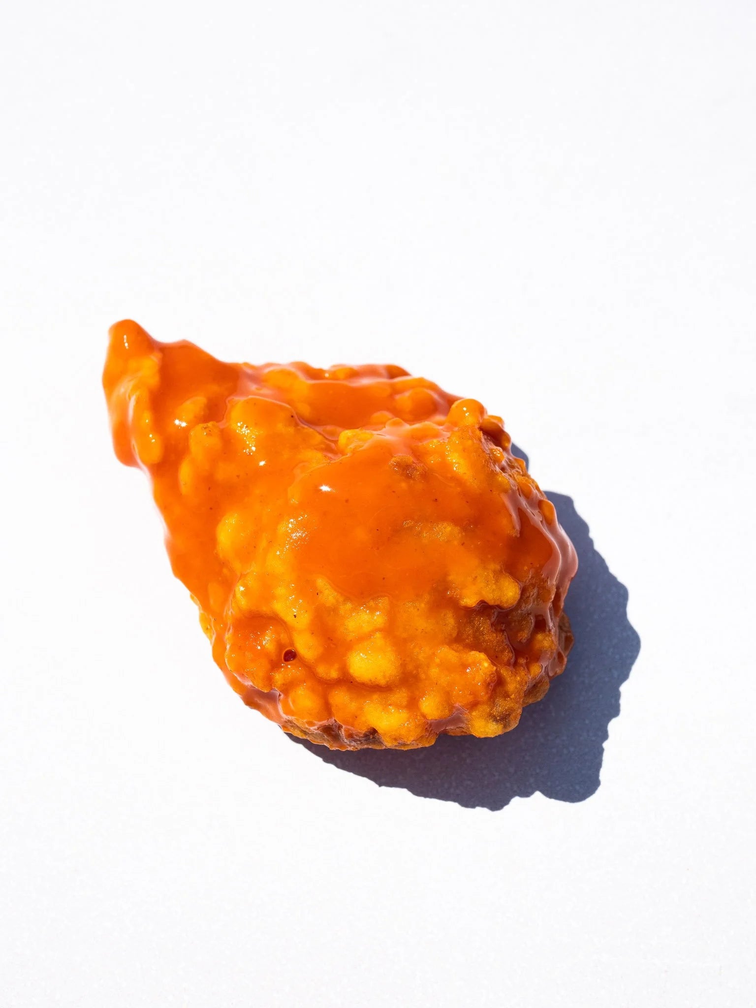 Blackbird Plant-Based Buffalo Wings coated with buffalo sauce