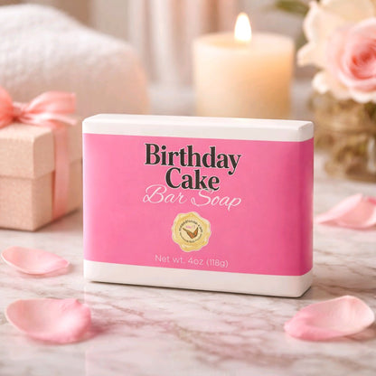 Birthday Cake bar soap box on a pink marbled countertop with pink petals