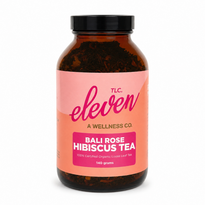 Eleven TLC Bali Rose Hibiscus Tea organic loose leaf tea in amber glass jar with black lid, 140 grams.