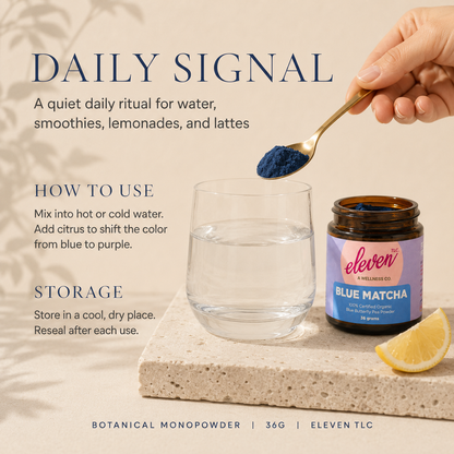 A spoon of Blue Matcha butterfly pea powder above water beside an open Eleven TLC jar, showing daily use for water, smoothies, lemonades, and lattes.