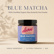 A spoon of Blue Matcha butterfly pea powder above water beside an open Eleven TLC jar, showing daily use for water, smoothies, lemonades, and lattes.