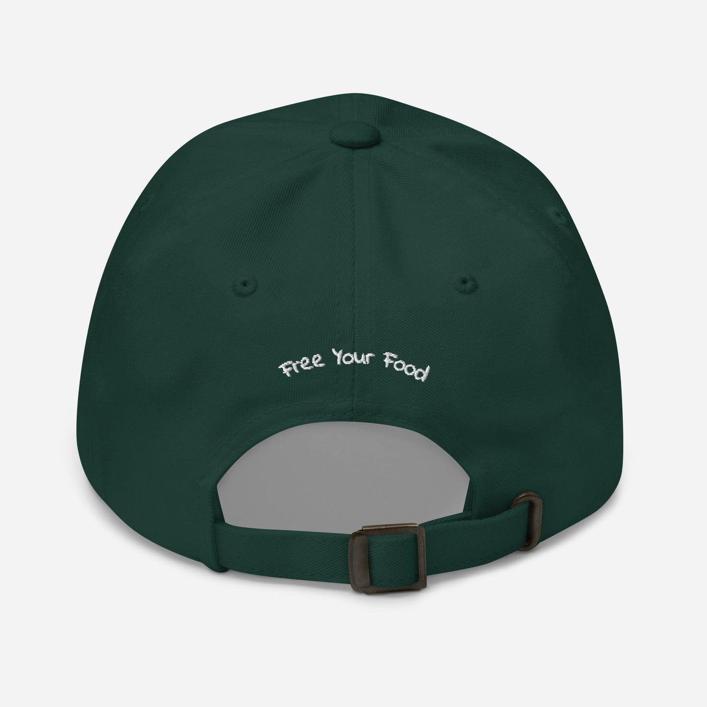 Flat lay back view of the Everyday Bare Life Cap in spruce green with 'Free Your Food' embroidered above the opening and antique buckle strap.