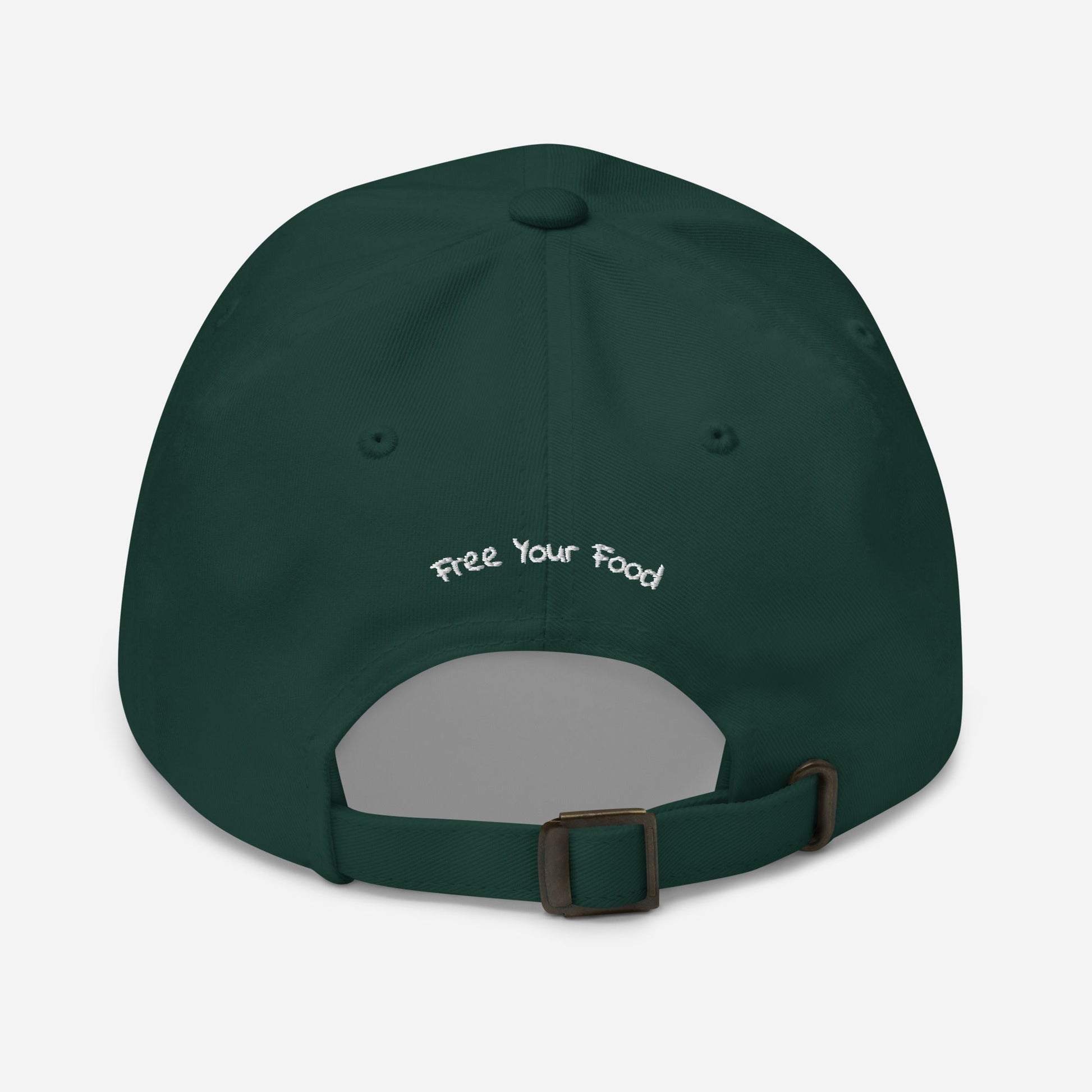 Flat lay back view of the Everyday Bare Life Cap in spruce green with 'Free Your Food' embroidered above the opening and antique buckle strap.