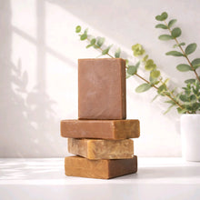 jewelweed bar soap stack on a white counter with greenery behind