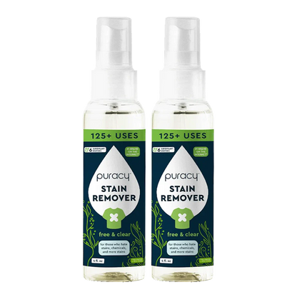 Two bottles of Puracy Laundry Stain Remover with spray tops and green labels.