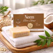 Neem bar soap on a towel with the box behind it