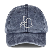Front view of Bare Life's navy denim Cocoa-Chic Cap with embroidered white Bare Life logo, washed vintage style.